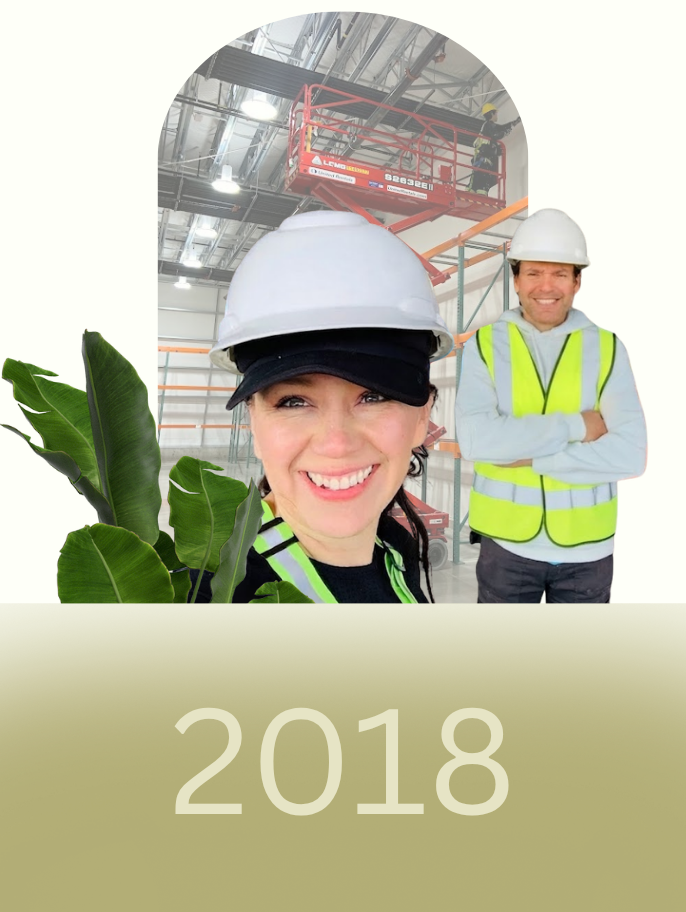 GreenTech Painting founders Yarinka Rojas and Juan Carlos Granados leading commercial and industrial painting projects in 2018 with elevated work platforms and professional safety practices.