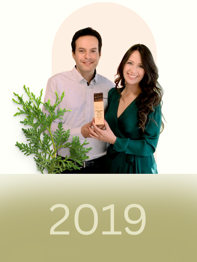 GreenTech Painting founders Yarinka Rojas and Juan Carlos Granados receiving a Green Leader Award in 2019 for their commitment to sustainability and environmentally responsible business practices.