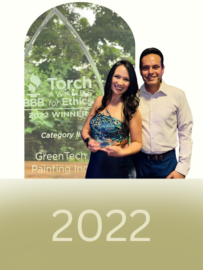 GreenTech Painting founders Yarinka Rojas and Juan Carlos Granados celebrating the 2022 BBB Torch Award for Business Ethics in London, Ontario.
