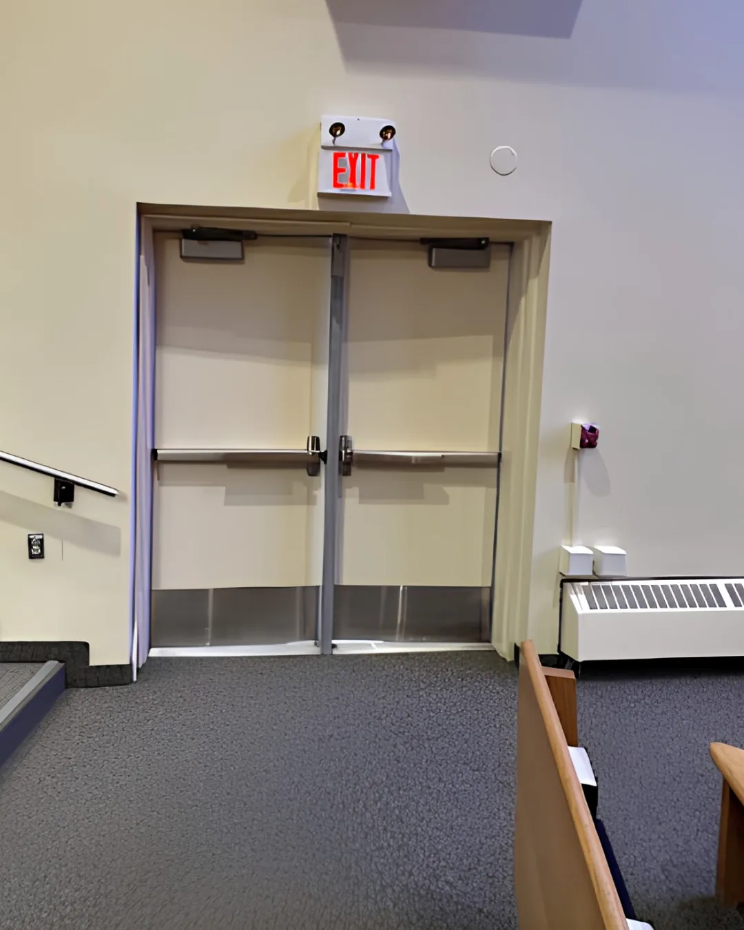 Professionally painted commercial interior walls and exit doors by GreenTech Painting in London, Ontario.