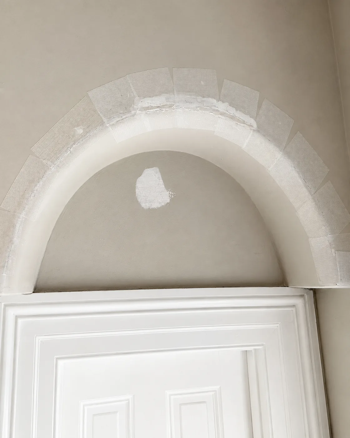 Professional drywall repair and wall patching before interior painting by GreenTech Painting in London, Ontario.