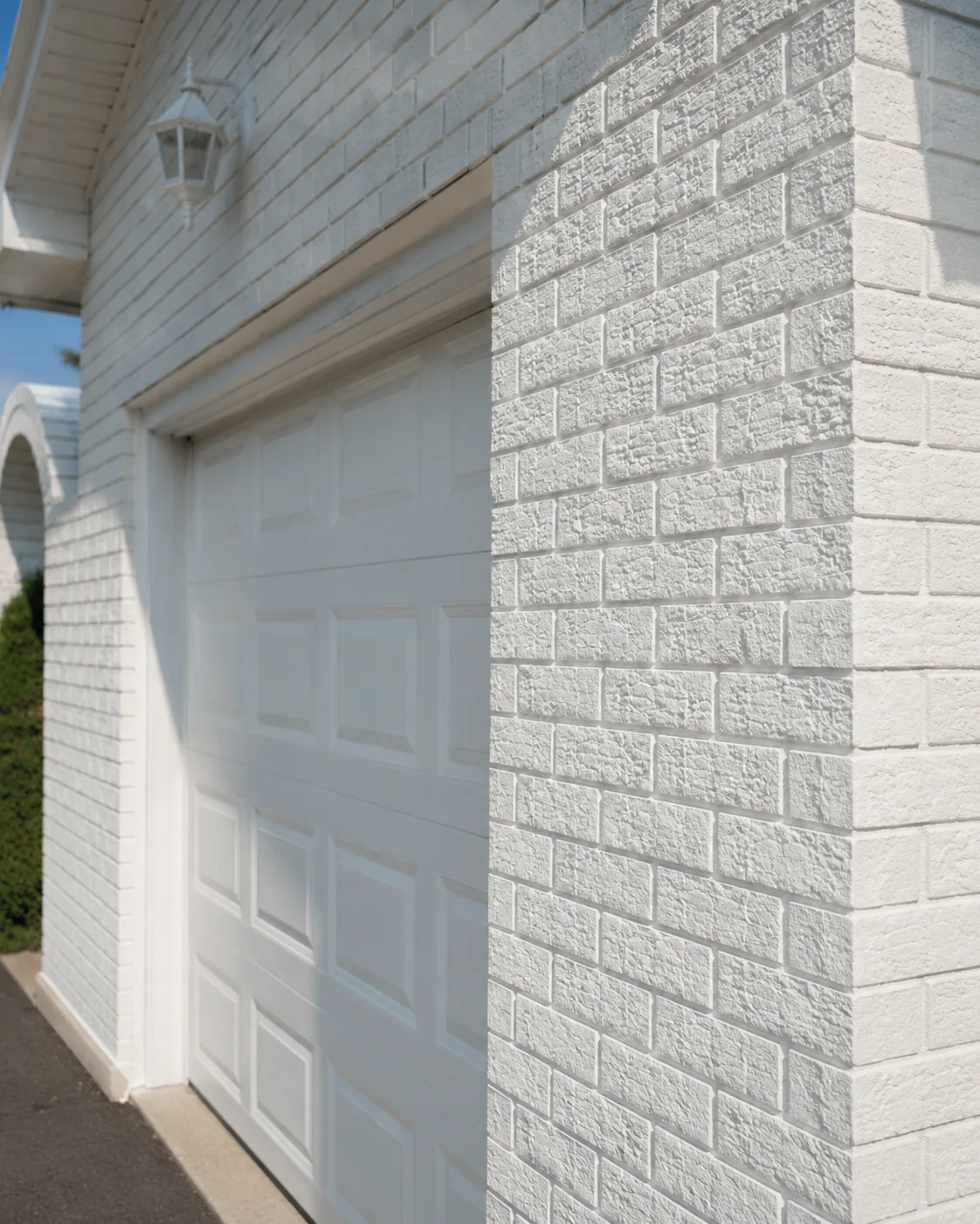 Professionally painted exterior brick siding on a residential home by GreenTech Painting in London, Ontario.