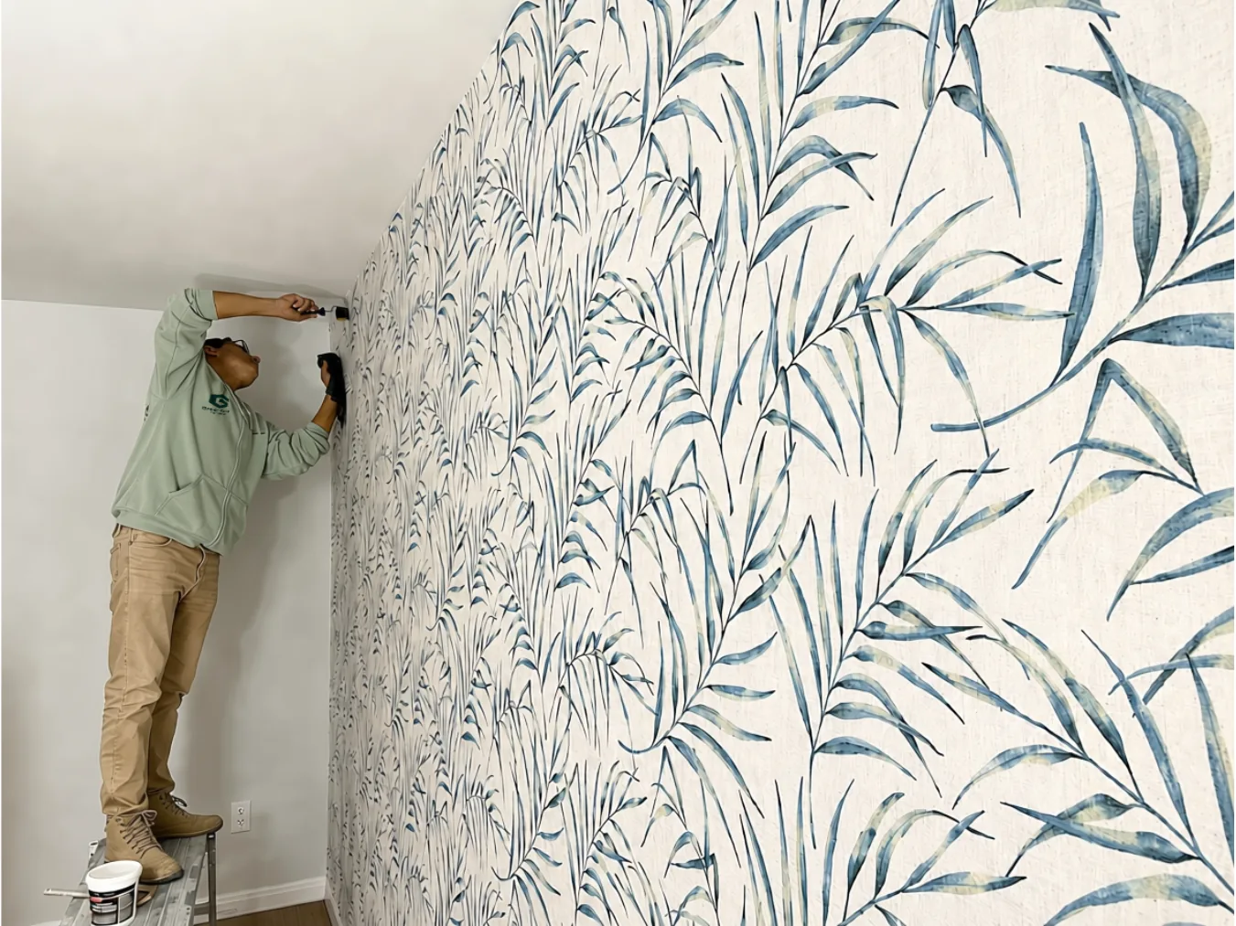Professional wallpaper installation featuring a botanical accent wall by GreenTech Painting in London, Ontario.